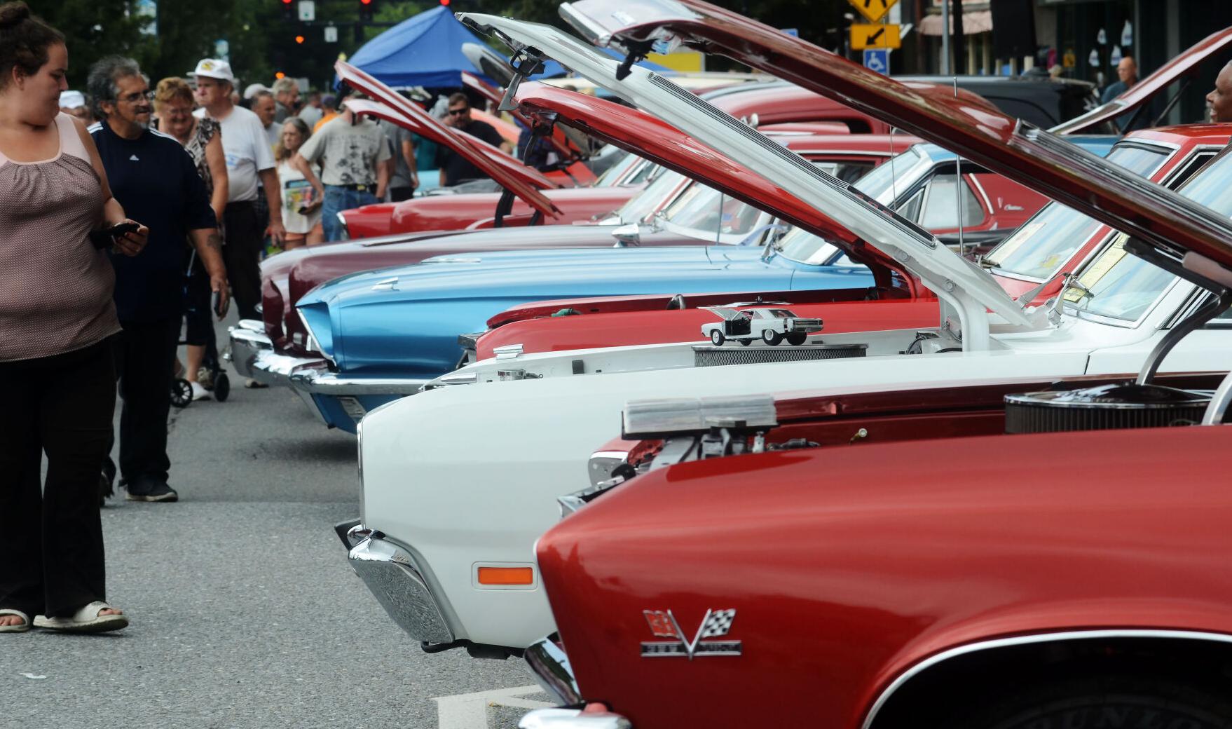 Spectators look at car engines